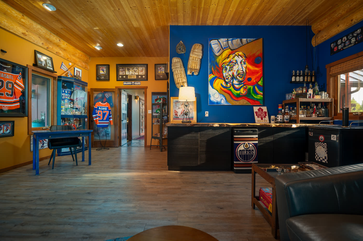 The games room bar, hung with signs and memorabilia