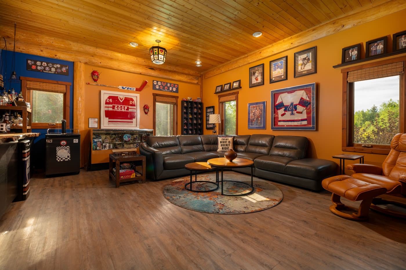 The games room, deep leather seating under warm ochre walls