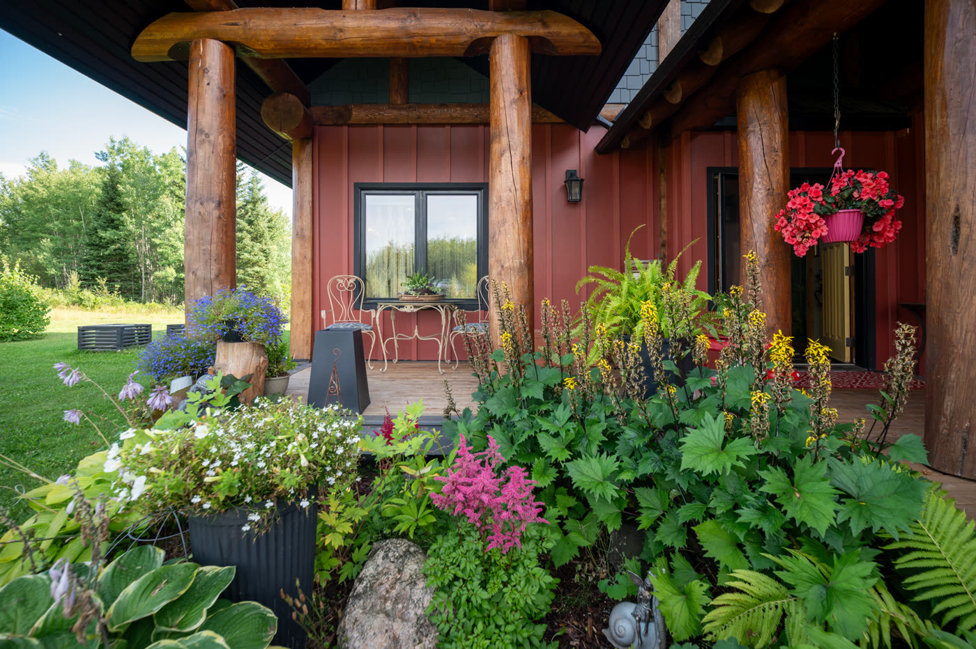 Dense planting and flower pots along the edge of the deck