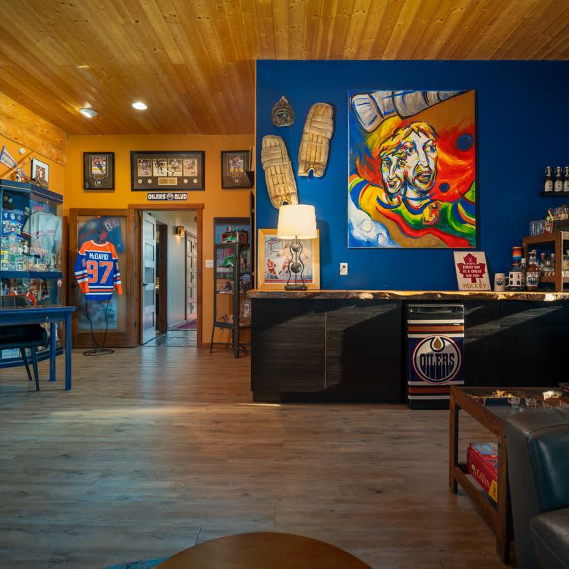 The games room, with a bar, hockey memorabilia and seating